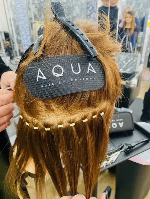 Dummy hair showing the Aqua logo